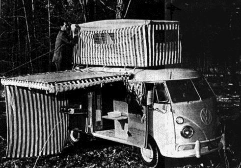 A documentary photo showing the early split bus with a side tent & additional tent on a roof rack.