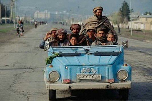 A group of Afghanistan tribe riding a VW Safari...